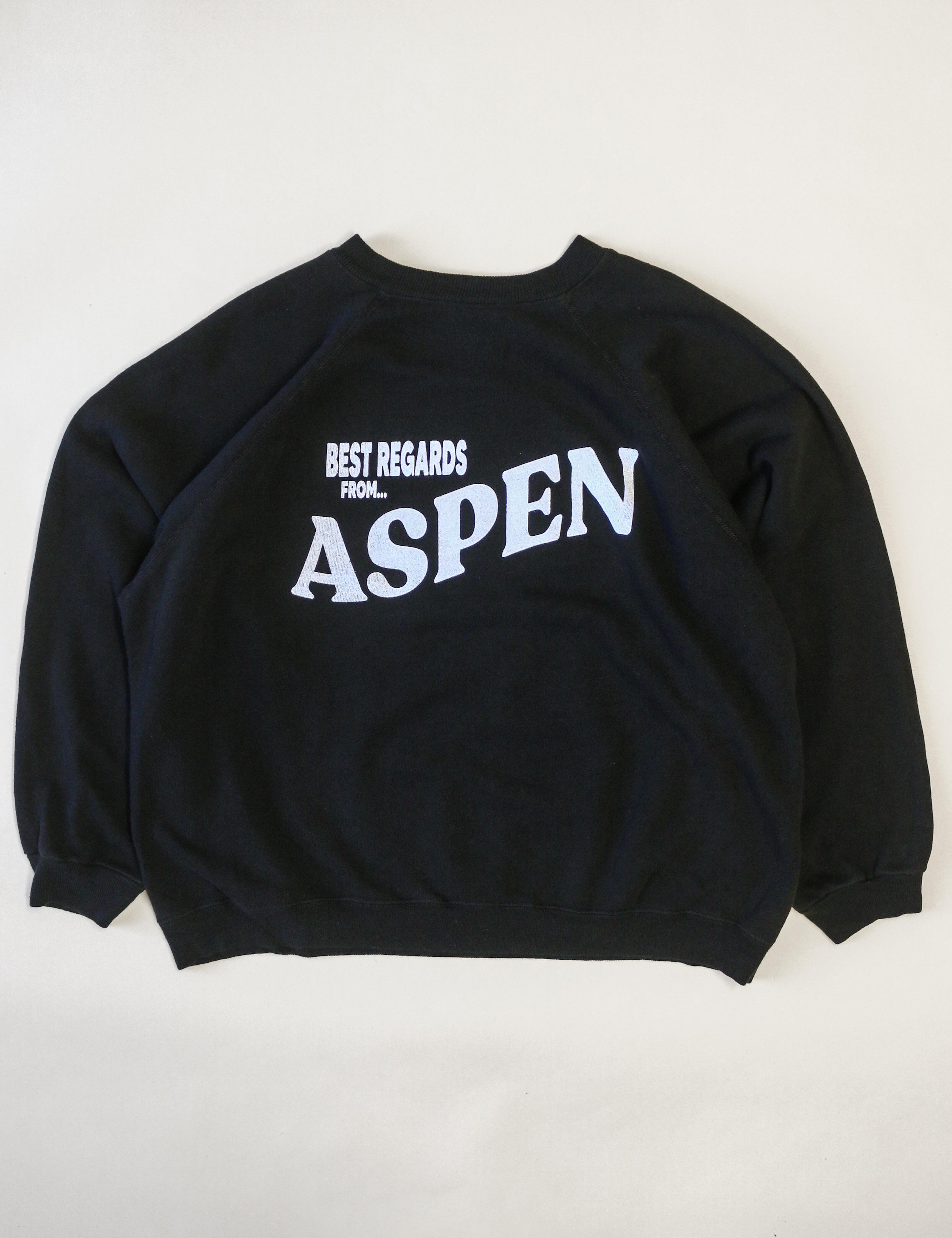 Black sweatshirt with 'Best Regards from Aspen' text on a white background