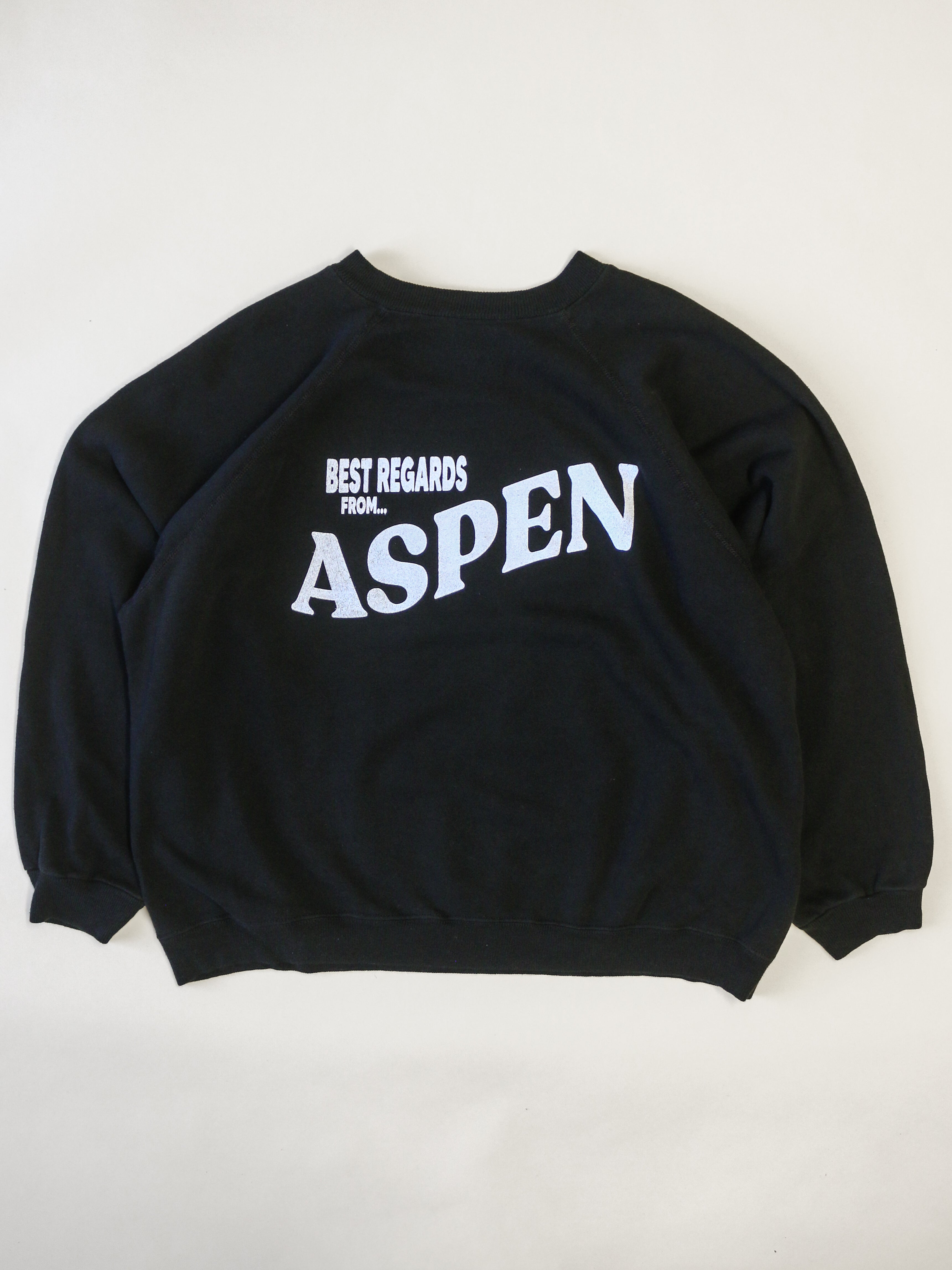 Black sweatshirt with 'Best Regards from Aspen' text on a white background